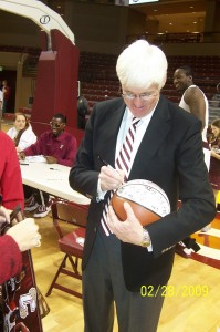 Coach Cremins signing basketballs after the game!